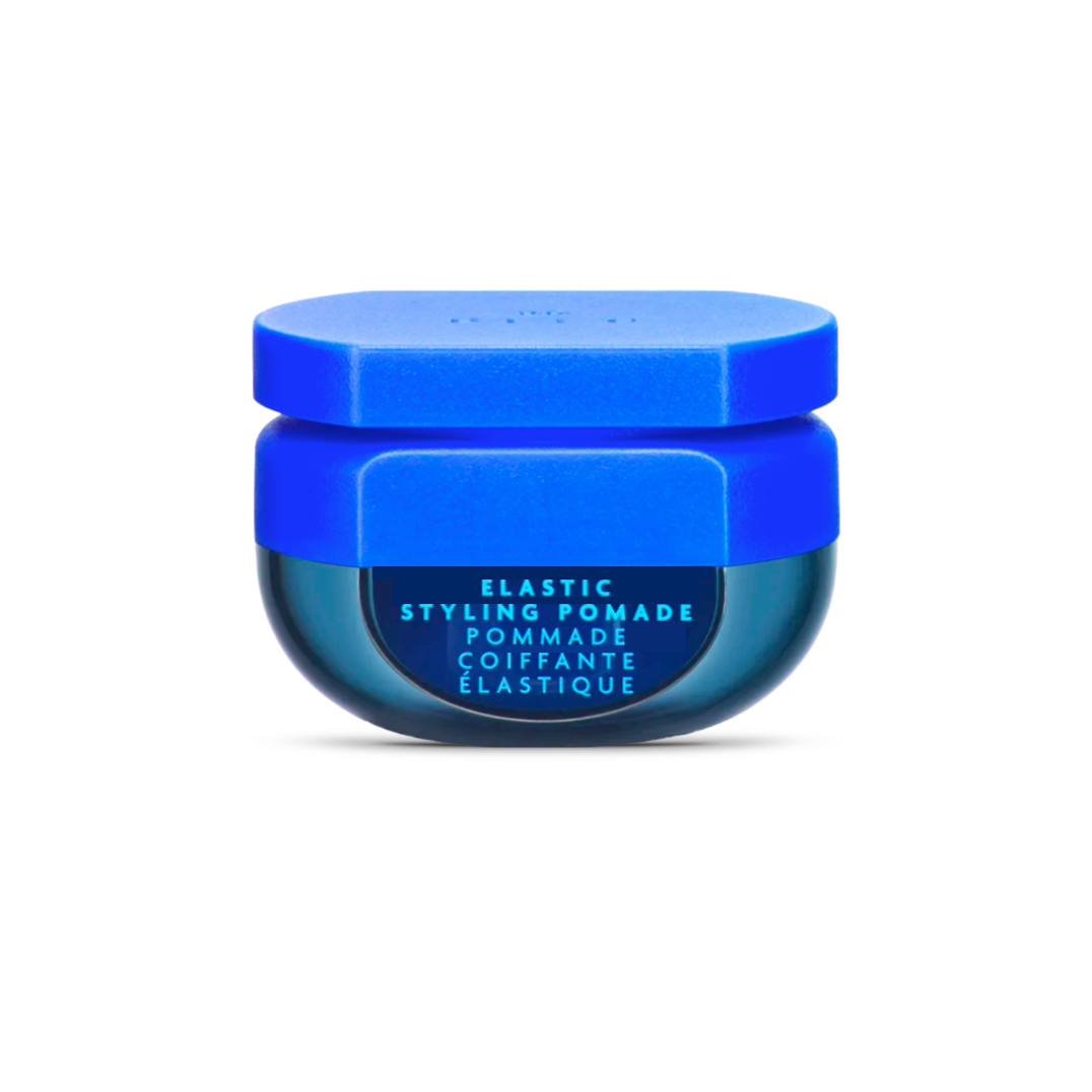 R+Co BLEU Elastic Styling Pomade in a distinctive blue jar, a versatile hair product for creating textured, moveable styles without the weight.