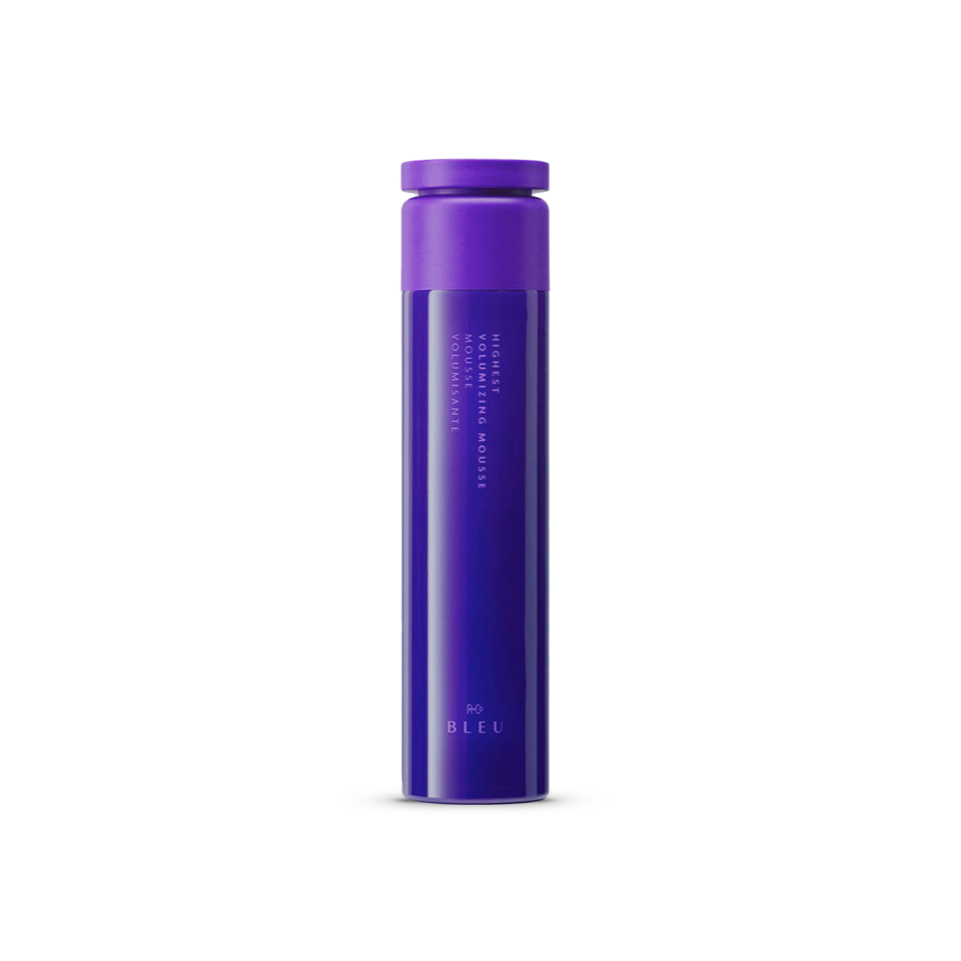 R+Co BLEU Highest Volumizing Mousse in a sleek, vibrant purple aerosol canister designed for luxurious, full-bodied hair styling.