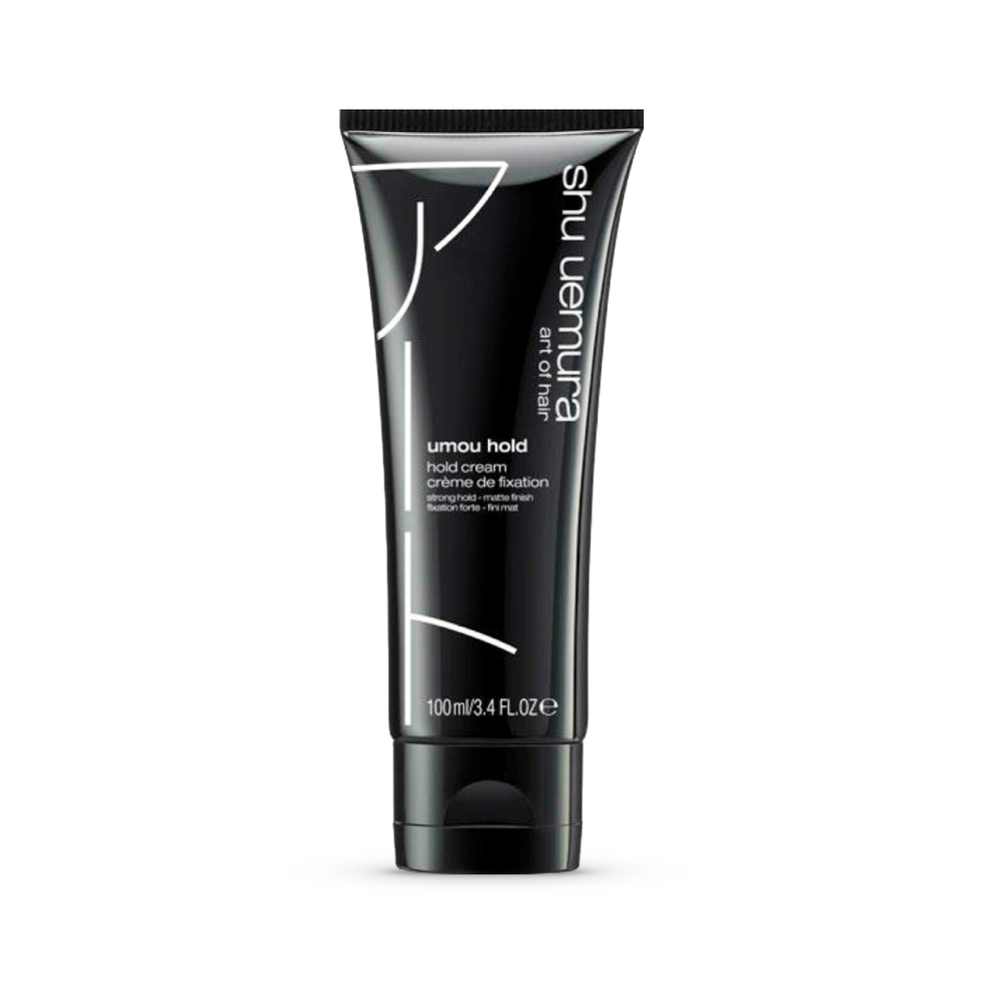 Sleek, black tube of Shu Uemura Umou Hold Hair Cream, 100ml/3.4fl.oz, designed to deliver a strong hold for short to medium hair without residue or stickiness, ensuring a polished and controlled style.