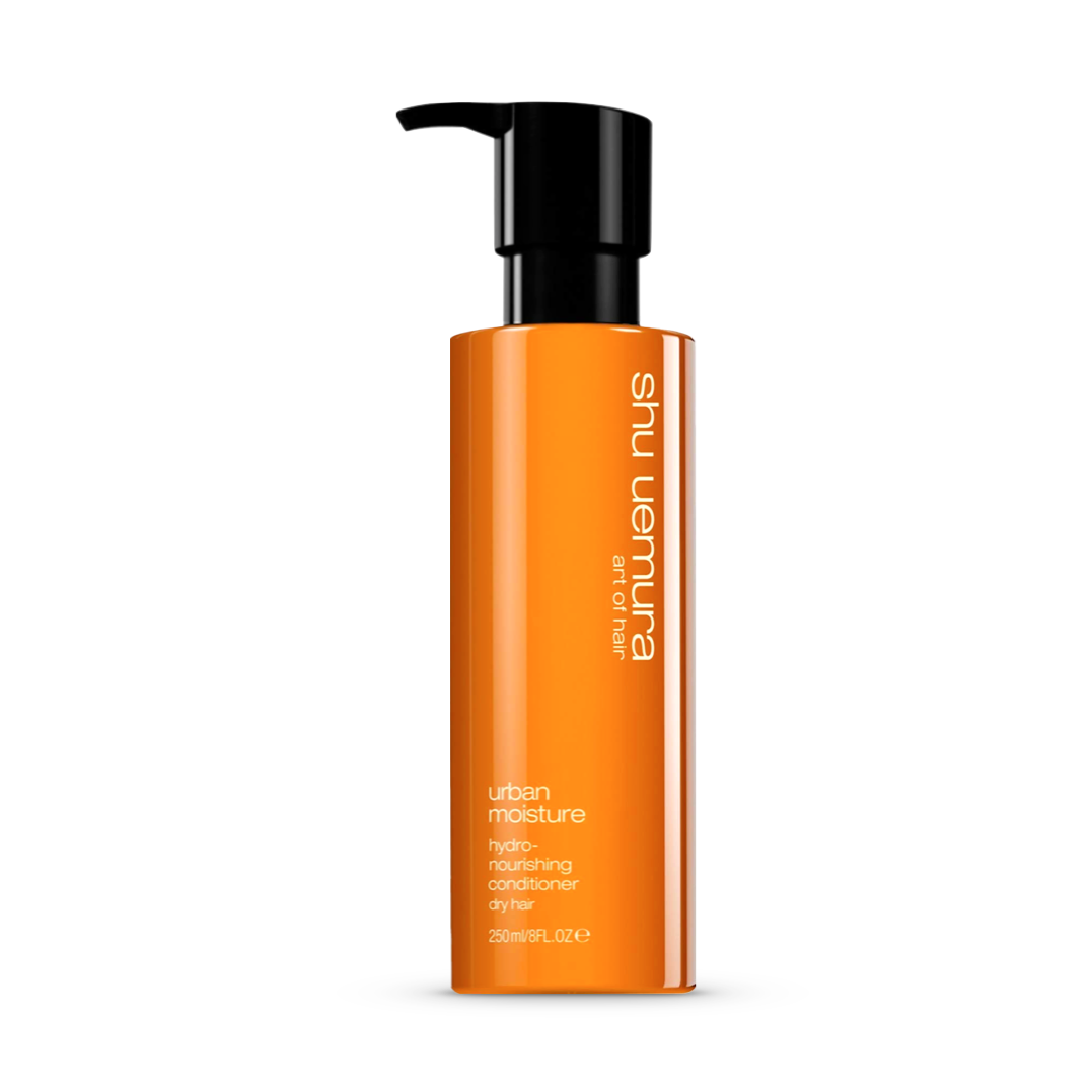 Tall, vibrant orange bottle of Shu Uemura Urban Moisture Hydro-Nourishing Conditioner with a convenient black pump. Designed specifically for dry hair, the 250ml/8fl.oz bottle promises sleek hydration and nourishment for a refined, healthy look.